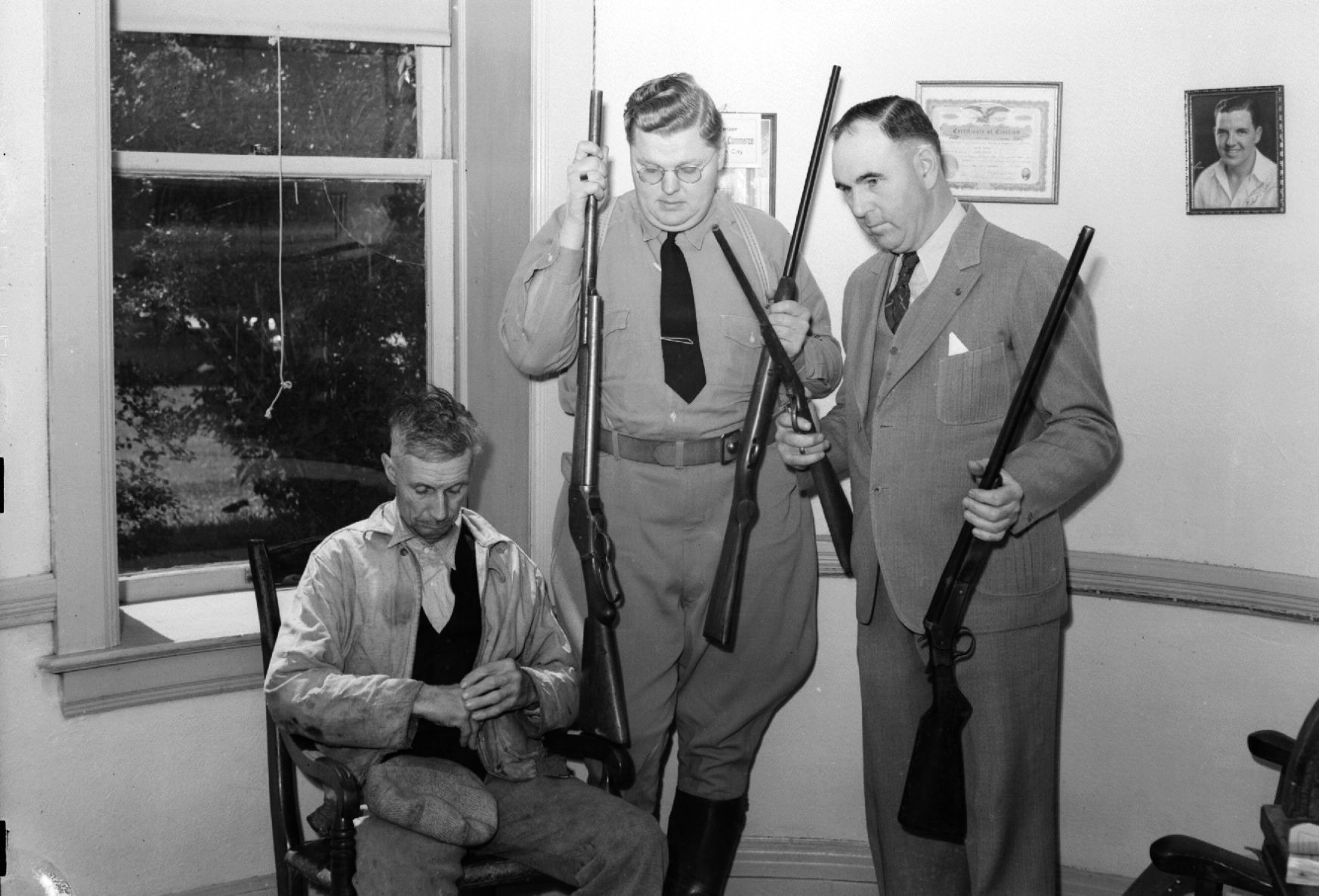 Man with deputy and Sheriff